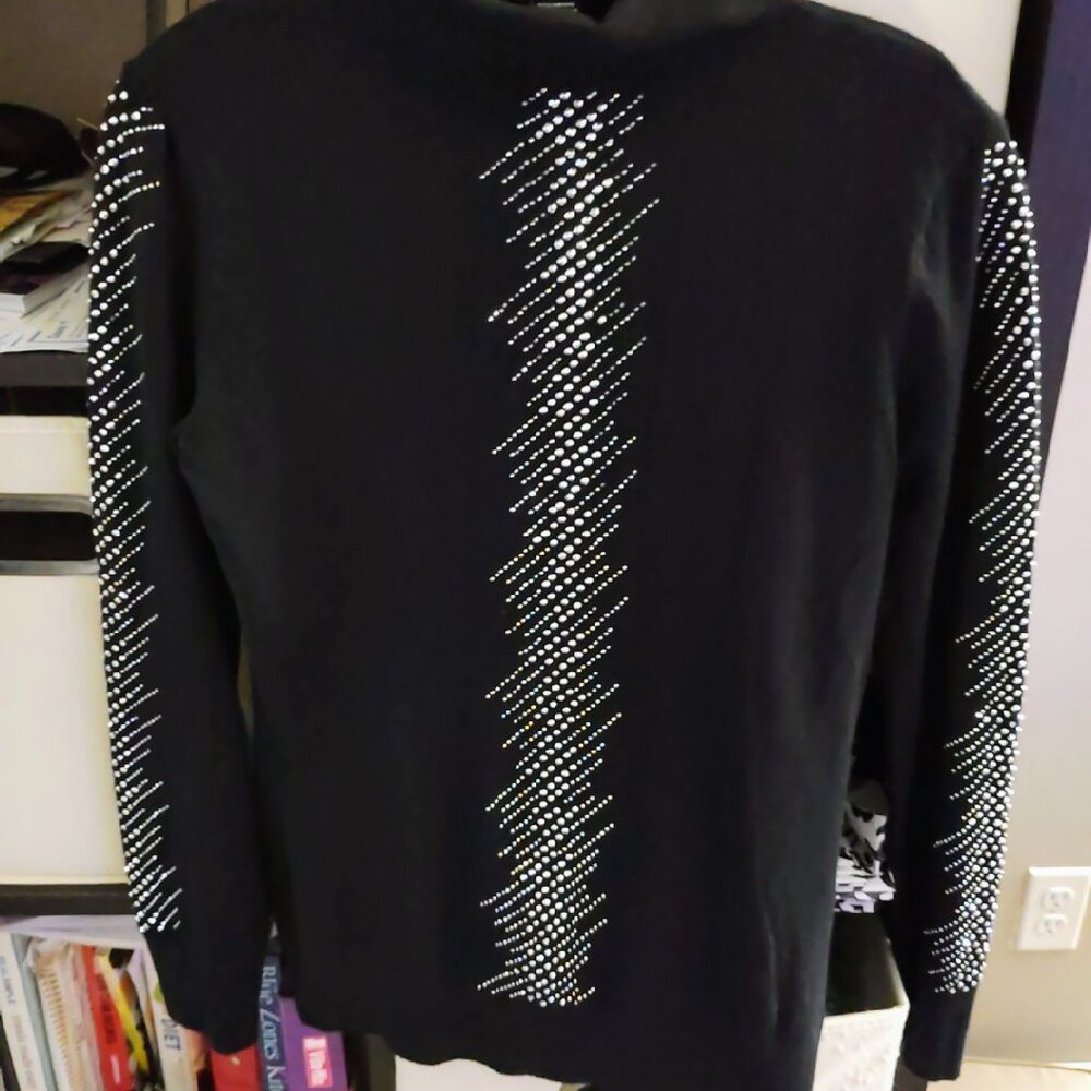 A black crystal embellished pullover that's ready to wear for the holidays ahead